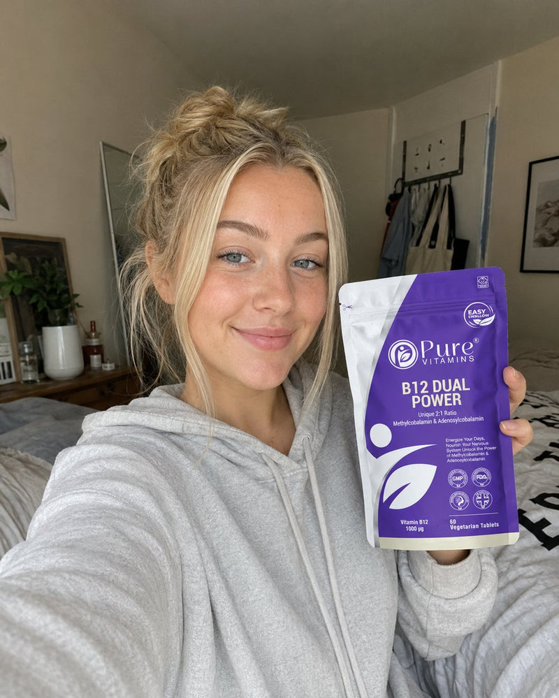 Customer holding a pouch of Pure Vitamins B12 Dual Power