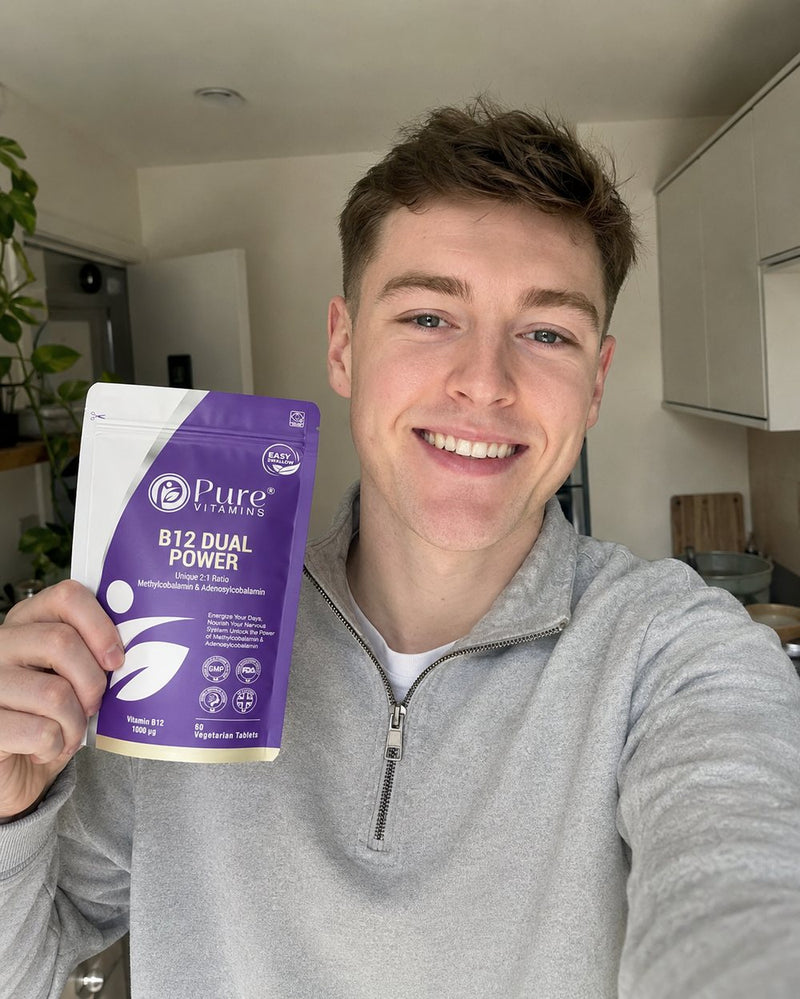 Customer holding a pouch of Pure Vitamins B12 Dual Power