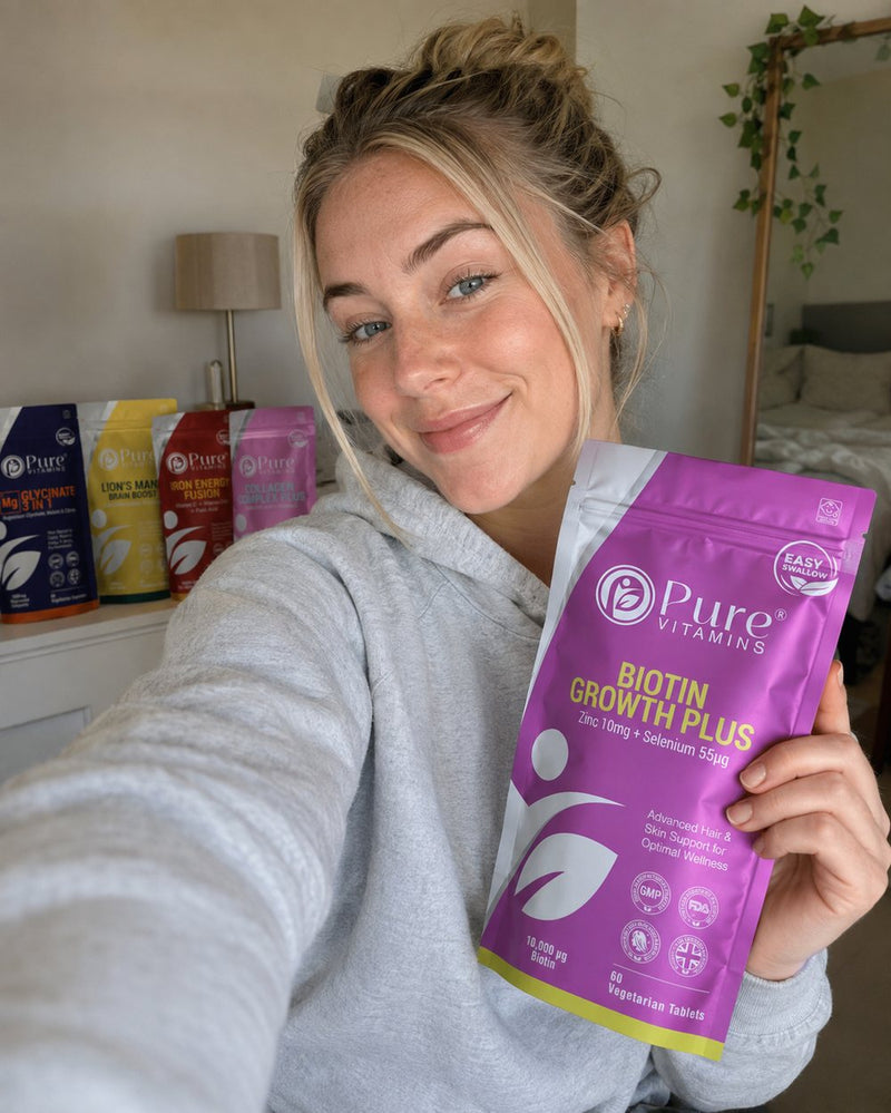 Customer holding a pouch of Pure Vitamins Biotin Growth Plus