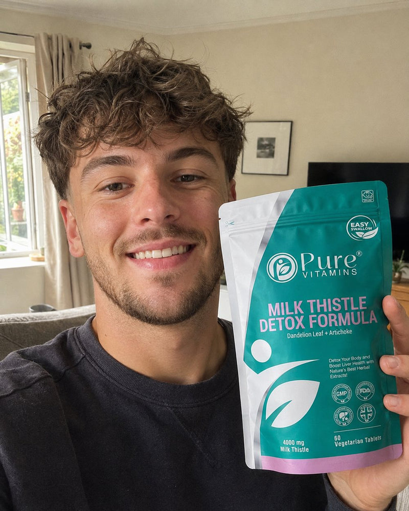 Customer holding a pouch of Pure Vitamins Milk Thistle Detox Formula